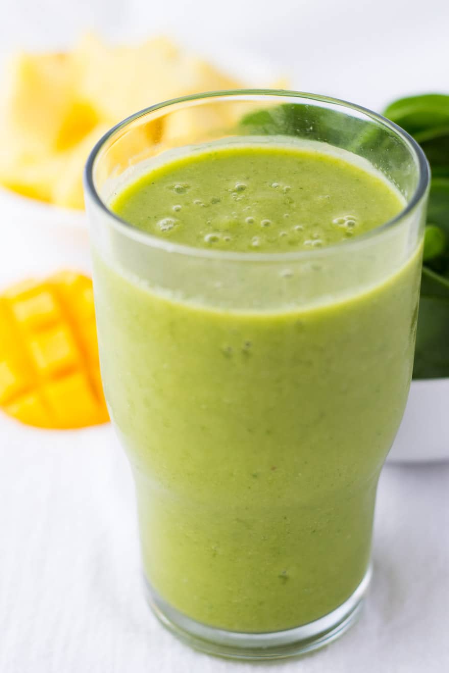 This Pineapple Mango Green Smoothie is so good! If you're new to green smoothies, you'll never taste the greens in this one. It's just pure tropical bliss.