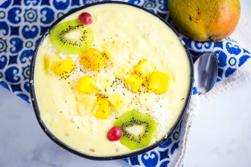 Mango Pineapple Smoothie Bowl with Tropical Fruit and Chia Seeds
