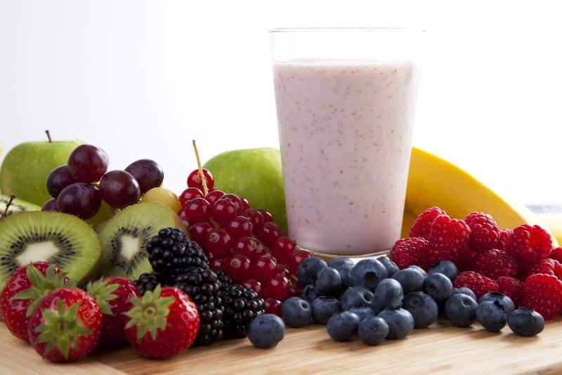 smoothie surrounded by fruit