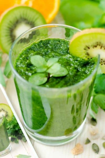 parsley and fruit smoothie in a glass