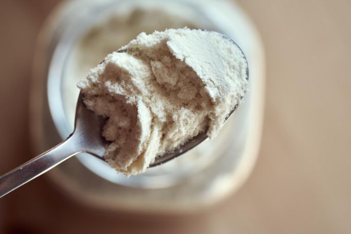 scoop of whey protein powder on a spoon