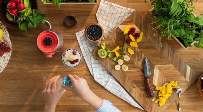 chopping up ingredients for smoothie